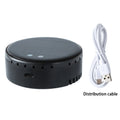 Black solar-powered car air humidifier mounted on a vehicle air vent.