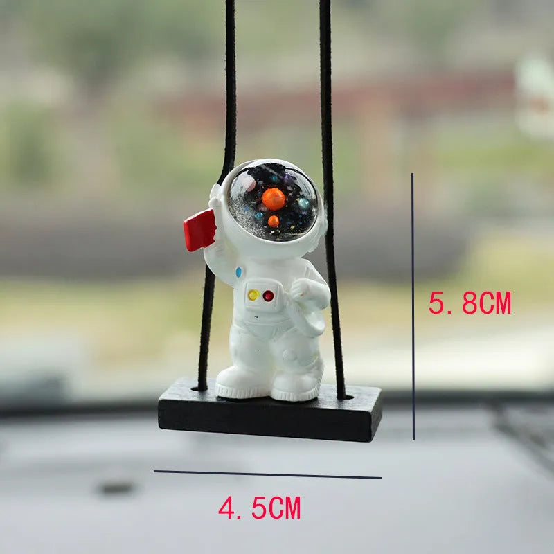 Resin astronaut car pendant showing five cartoon astronaut designs for vehicle decoration
