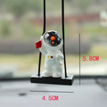 Resin astronaut car pendant showing five cartoon astronaut designs for vehicle decoration