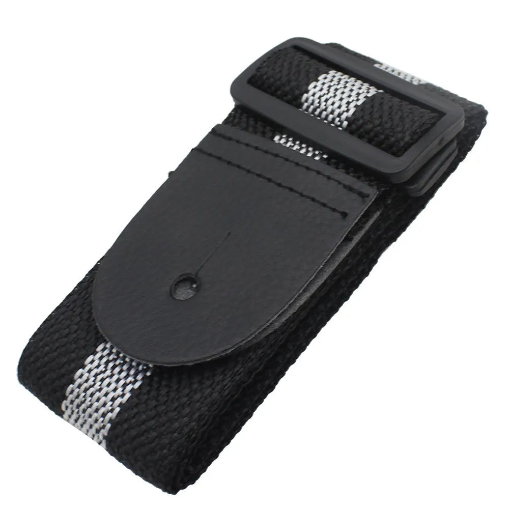 A woven crossbody guitar strap with a stripe pattern, shown attached to an electric guitar.
