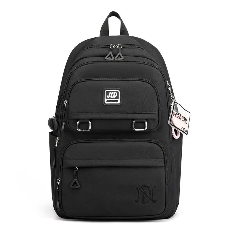Purple and geometric design girls large capacity nylon backpack with curved backpanel.