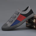 Men's low top canvas sneakers with an elastic band and vulcanised rubber sole in beige colour.