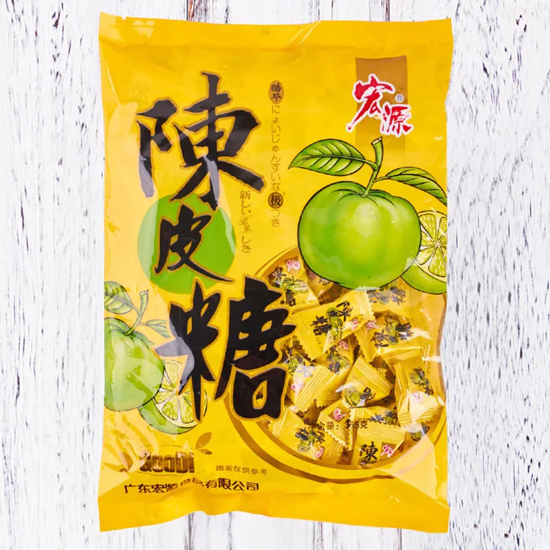Bag of mixed hard candies in plum, guava, and tangerine peel flavours, total weight 1055g.