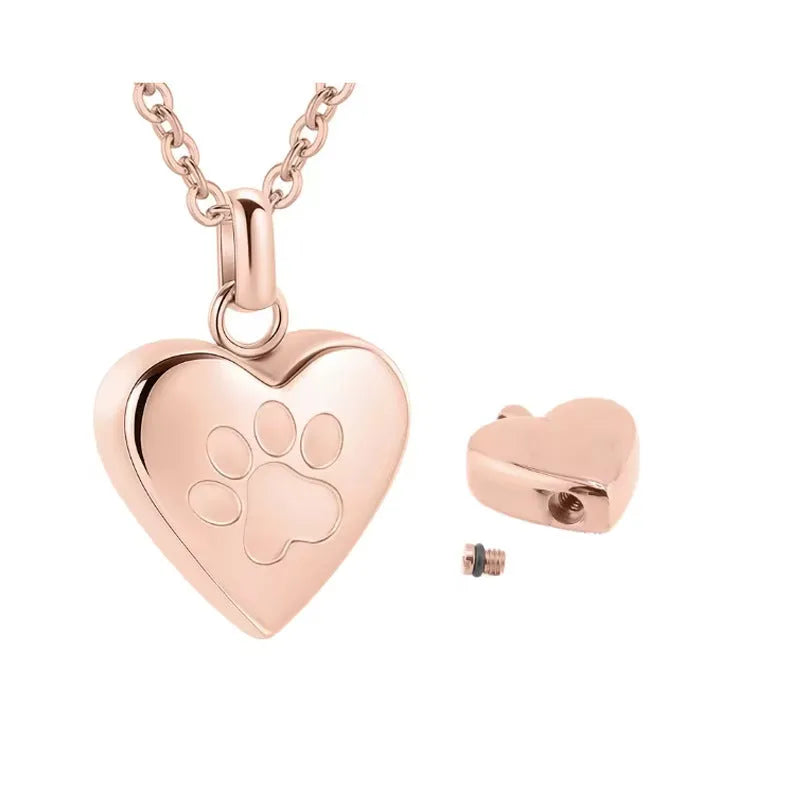 Silver heart-shaped titanium steel casket necklace with a paw print, shown open and closed.