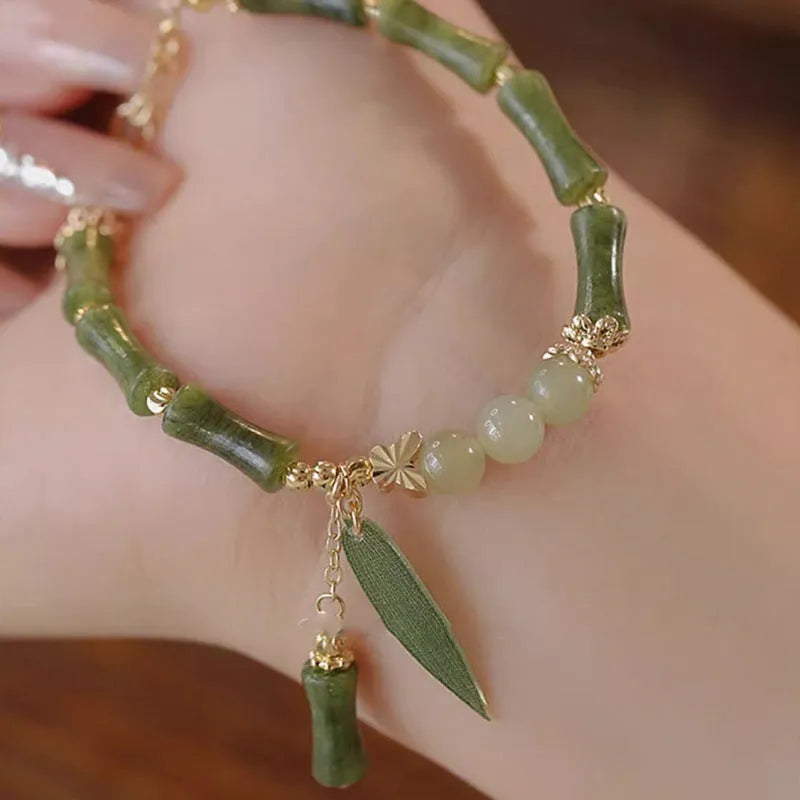A Chinese style glass bead bracelet for women featuring bamboo joint design elements.