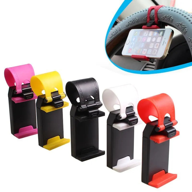 Black universal steering wheel phone holder clip mounted on a car steering wheel.