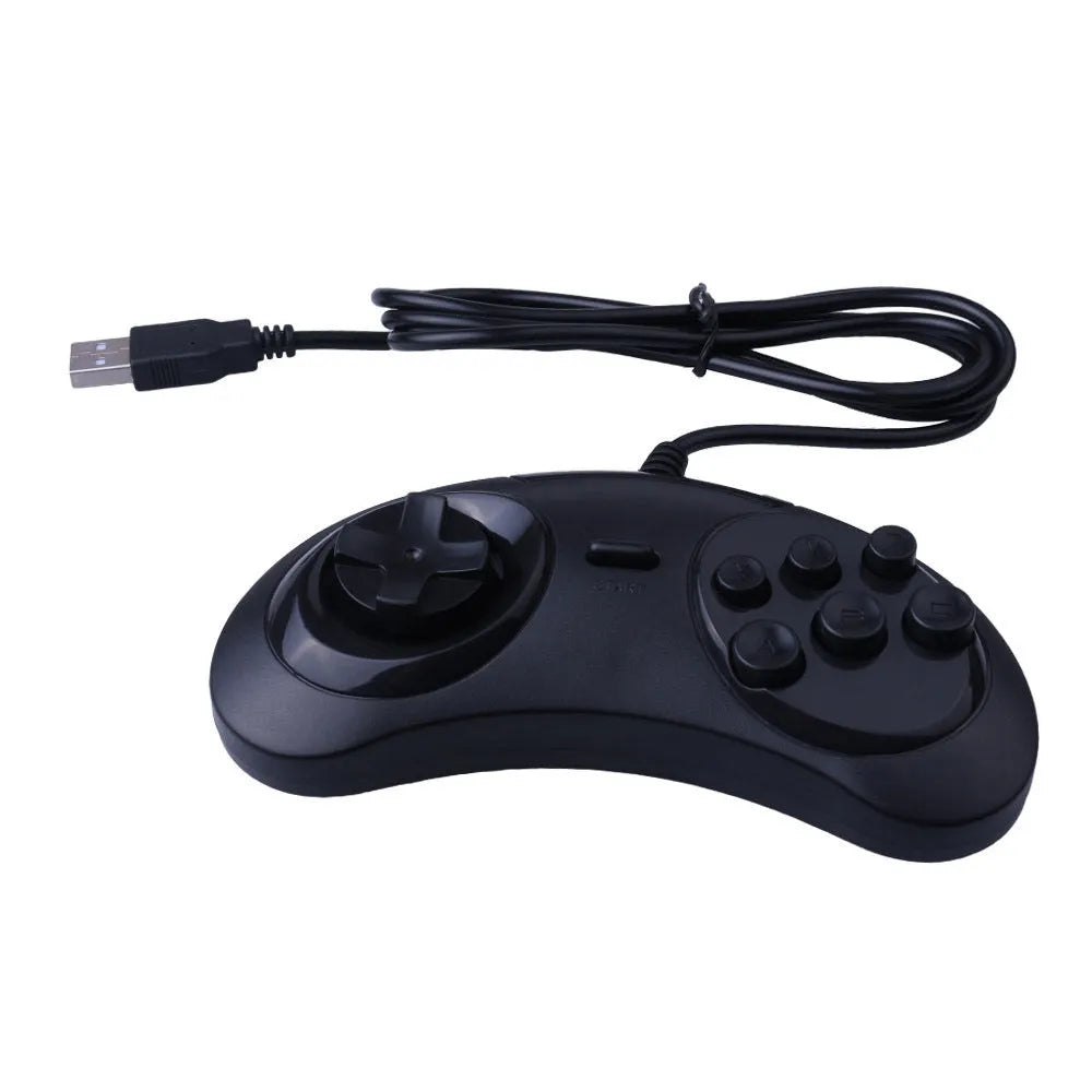 Black Sega USB PC gaming controller with long cable on a desk.