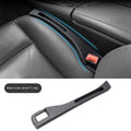 Black car seat gap storage box with handle between vehicle seats