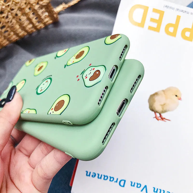 TPU phone case with a green painted cartoon avocado design on the back.