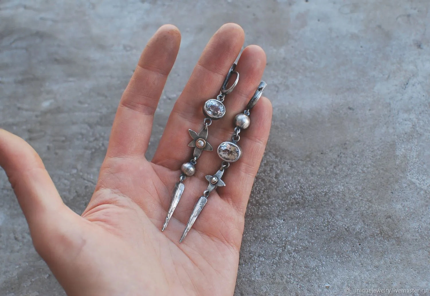 Geometric XINGX pendant earrings with antique silver finish and rhinestone detailing