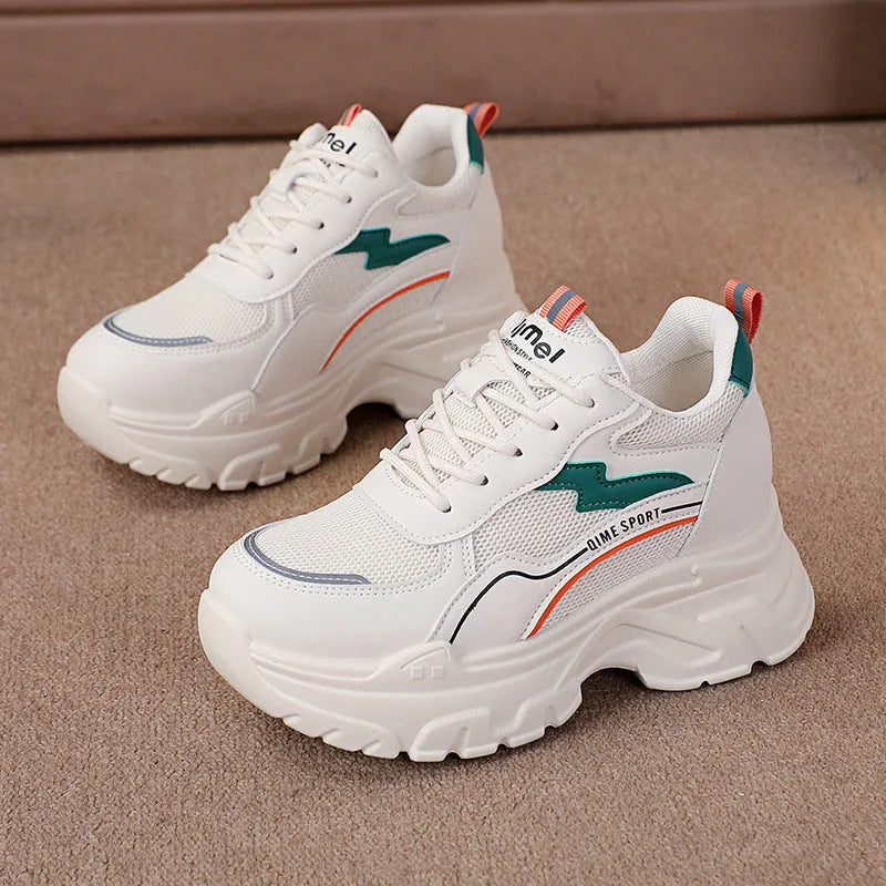 White women's dad shoes with cross straps, lace-up front, and a breathable mesh upper.