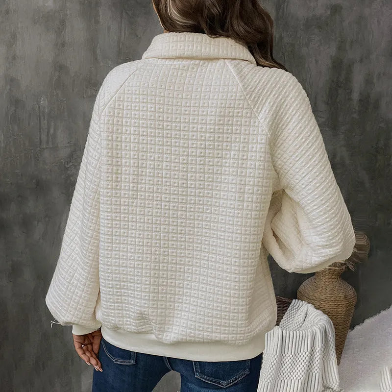Women's beige polo neck thick polyester sweater on a hanger