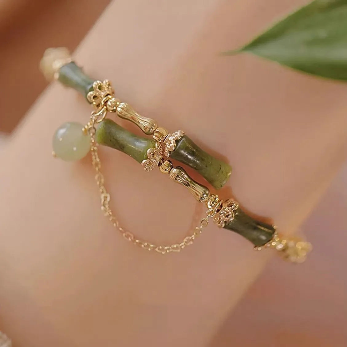 Women's plum wine coloured bamboo joint bracelet with adjustable beaded design