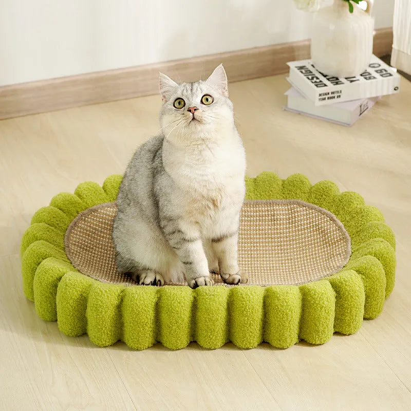 Green oval cat scratch pad bed with sisal scratching surface measuring 650x420mm