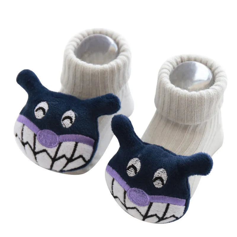 Cotton baby floor socks in blue bow pattern for infants 0-3 months.