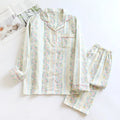 Women's cotton gauze pyjama set with long sleeves and trousers in a colour stripes or fruit print pattern.