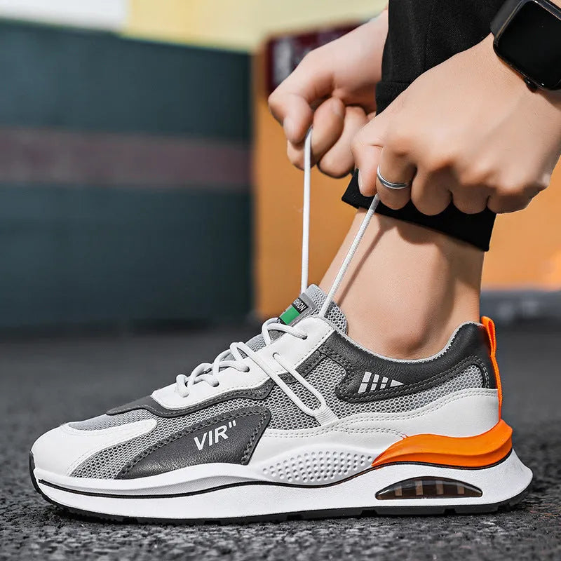 Men's gray mesh running shoes with EVA sole and round toe, shown from side view