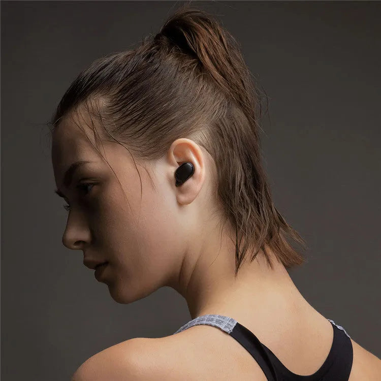 Redmi AirDots True Wireless black earbuds and charging case with three earplug sizes.