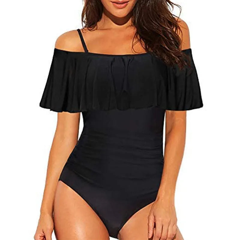 Black one-piece swimsuit with cut-out design and ruffled straps on the tube top