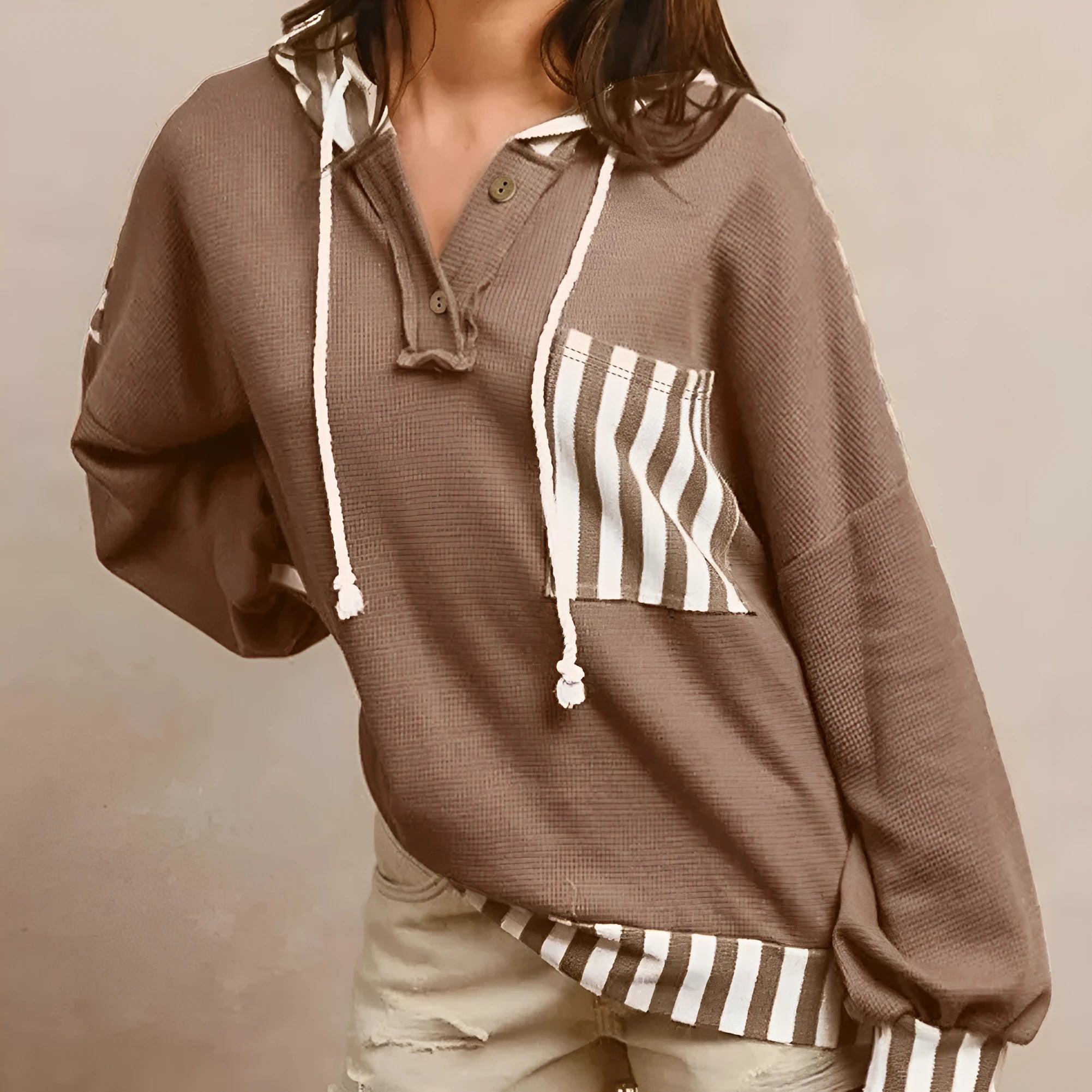 Straw yellow waffle texture hoodie with striped patchwork design and button neck