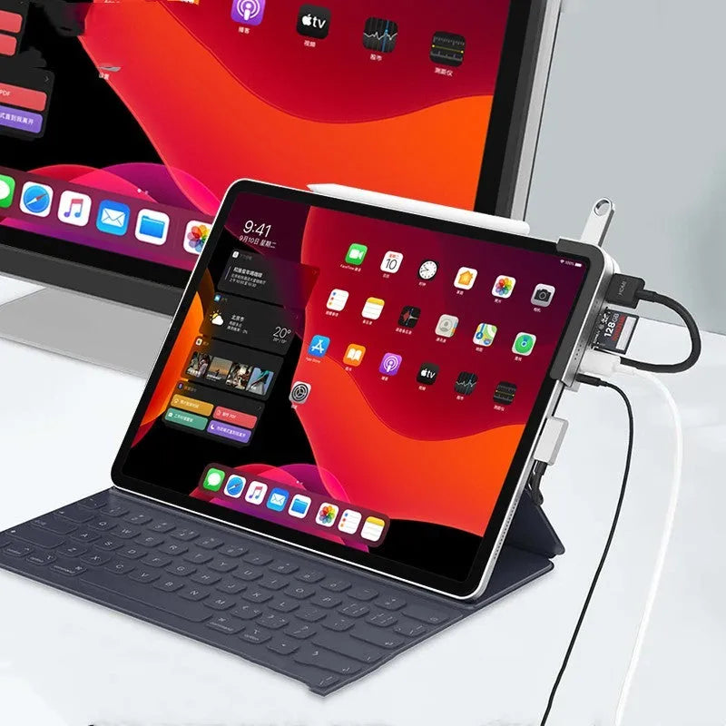Silver aluminium grey USB-C docking station and converter hub for iPad Pro with multiple ports.