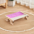 Wooden cat hanging bed hammock shown attached to a balcony railing.