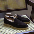 Men's brown genuine leather British handmade loafers on a white background.