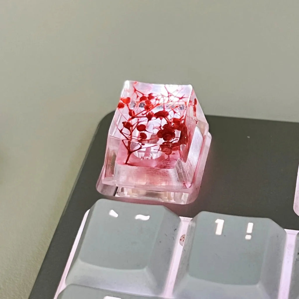 Transparent resin mechanical keyboard keycap with starry sky design in one of four colour options
