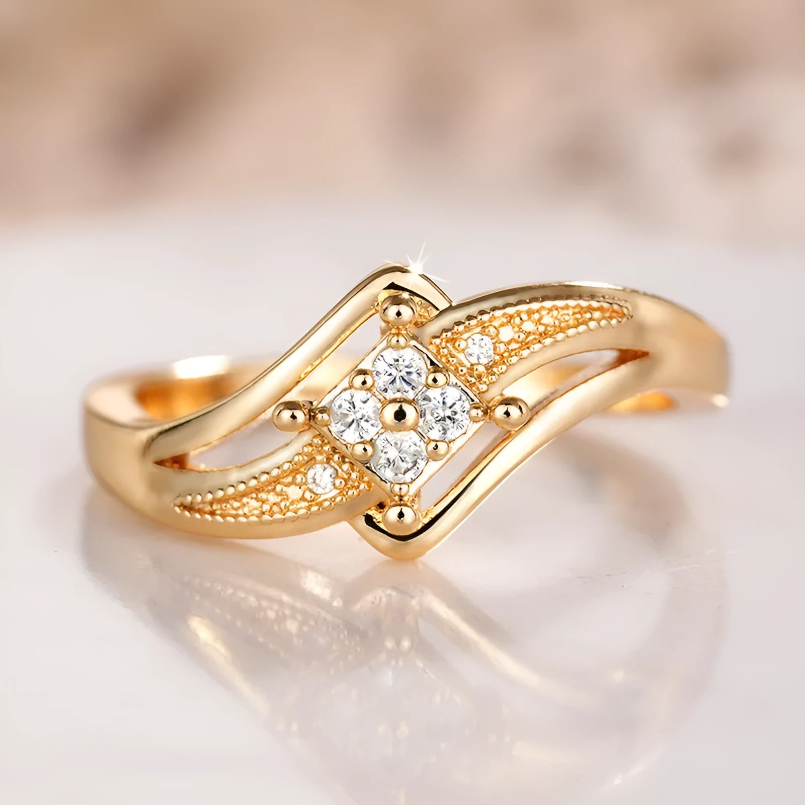 Women's geometric copper ring with micro inlaid zircon details in yellow gold colour.