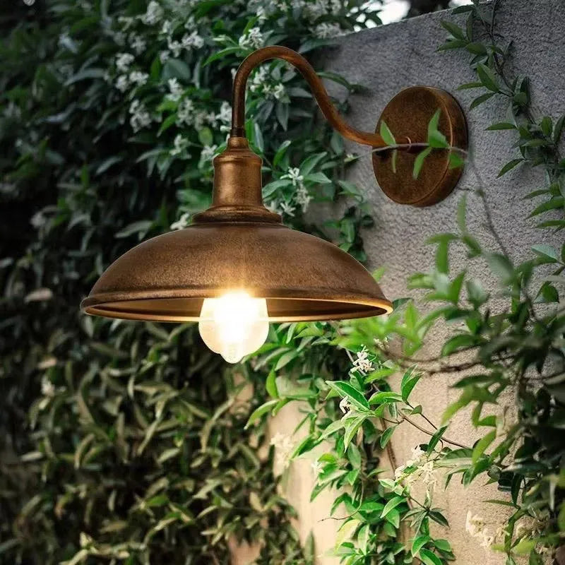 Retro style silver courtyard wall lamp mounted at right angle on villa exterior wall