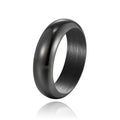 Glossy electroplated titanium steel ring in gold, black and steel colours showing detailed finish
