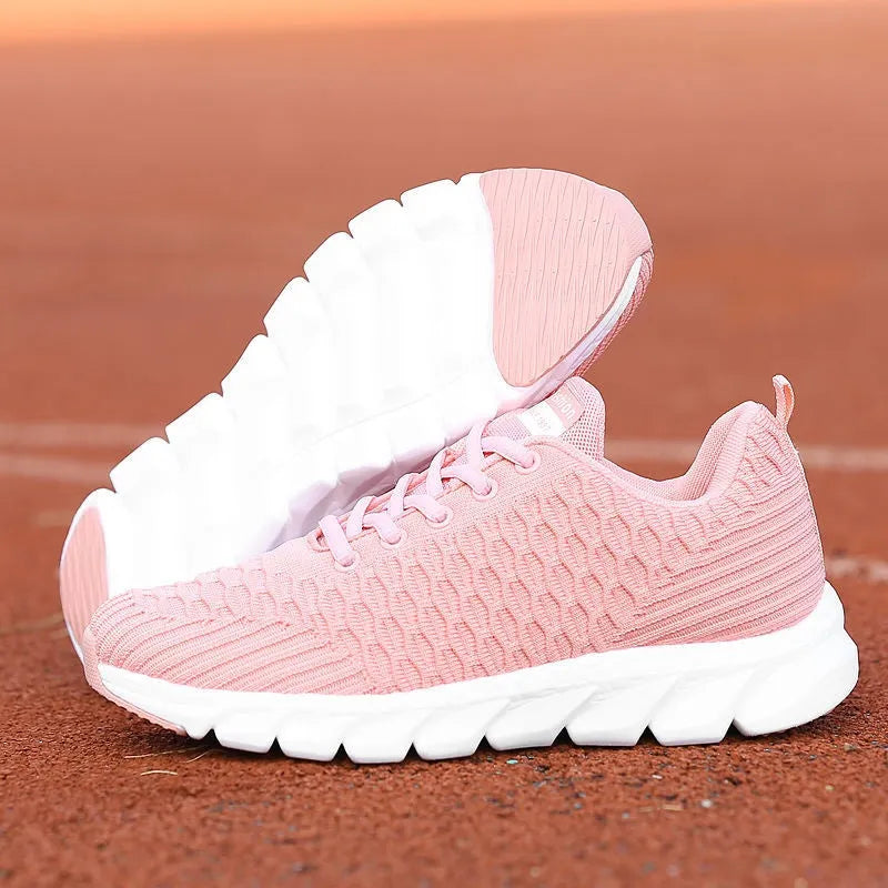 Women's running shoes in black, pink, or white with fly weaving upper and wear-resistant outsole