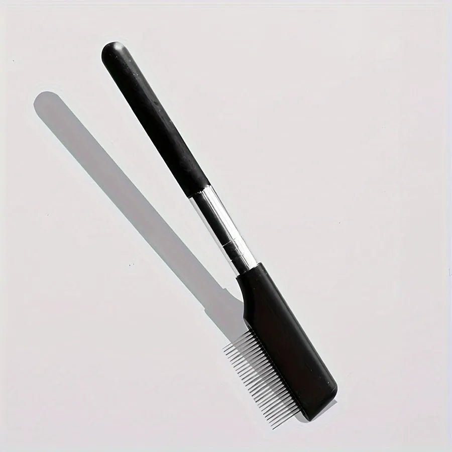 Black pet grooming brush with soft bristles and a comb for gentle eye cleaning on dogs and cats.