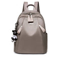 Medium wine red Oxford cloth rucksack with double shoulder straps showing internal organisers