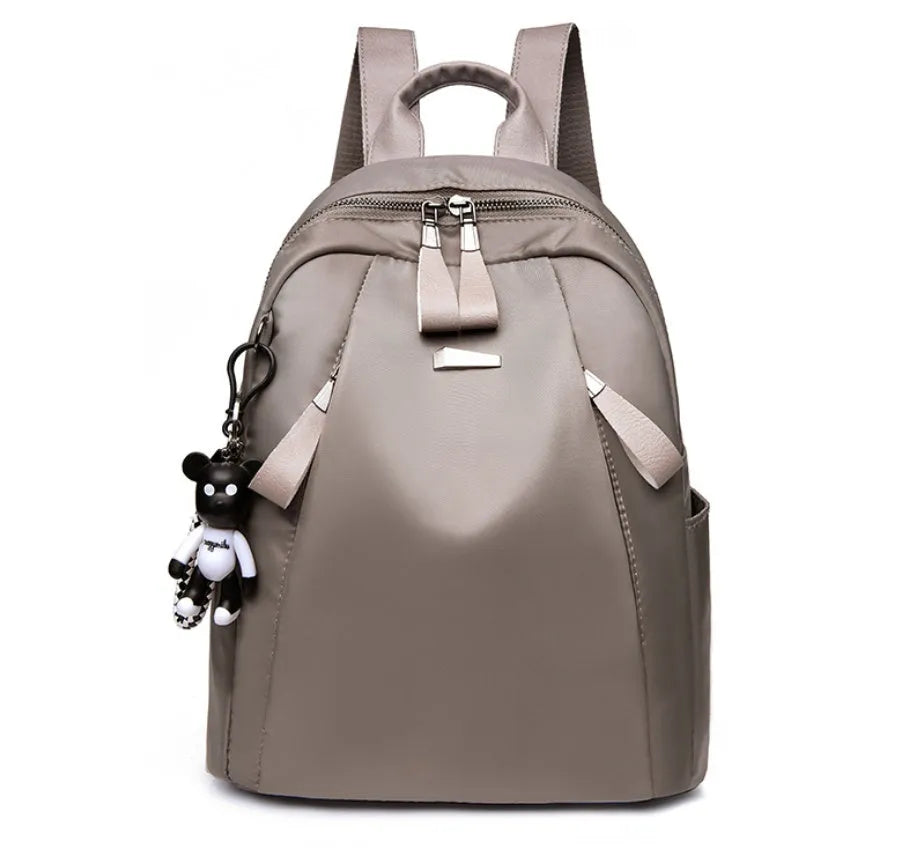 Medium wine red Oxford cloth rucksack with double shoulder straps showing internal organisers