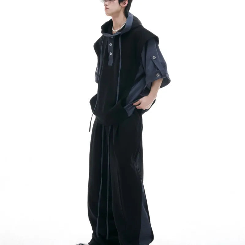 Men's black polyester hooded jacket with three-dimensional stitching on sleeves, paired with matching trousers
