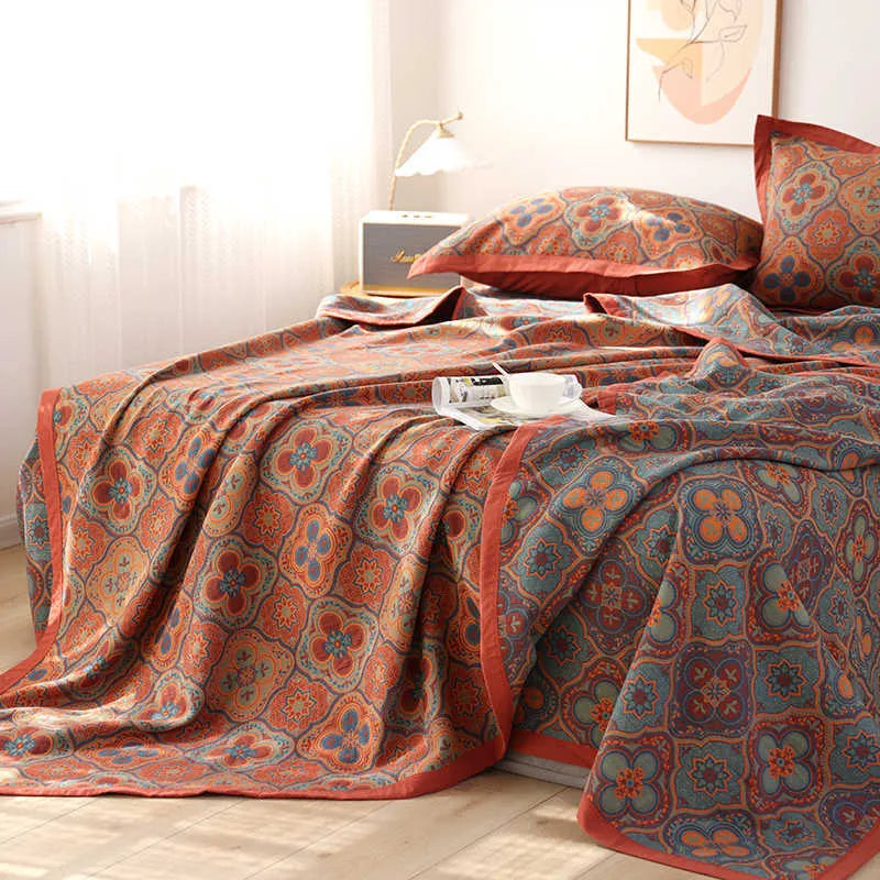 Cotton gauze bed blanket three-piece set with floral pattern showing blanket and two pillowcases