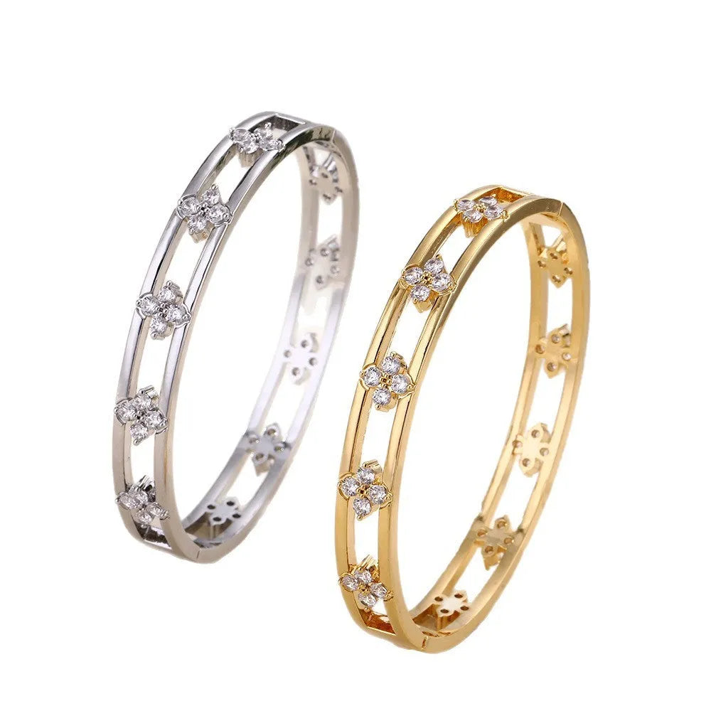 Women's hollow bracelet with four-leaf clover design in gold or silver options