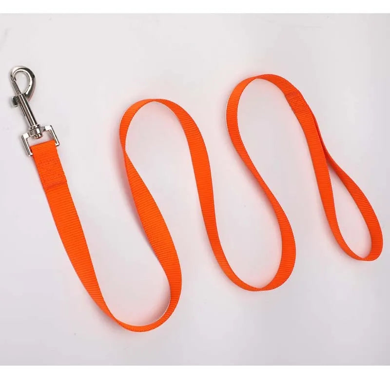 Solid colour polyester dog walking rope held in a hand, showing one of twelve colour options and its simple rope design.