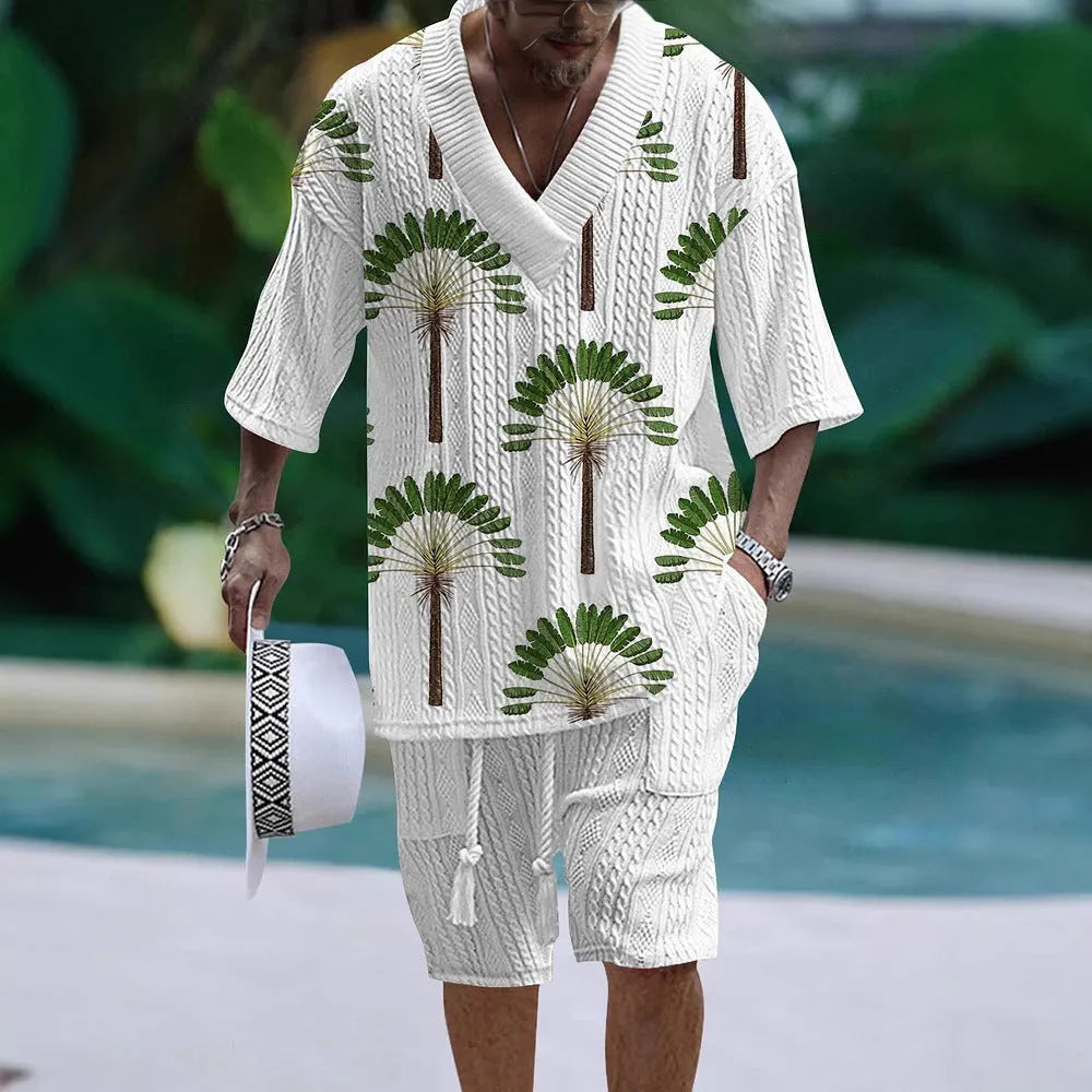 Man wearing a loose blue short sleeve suit top and matching shorts for casual summer wear.