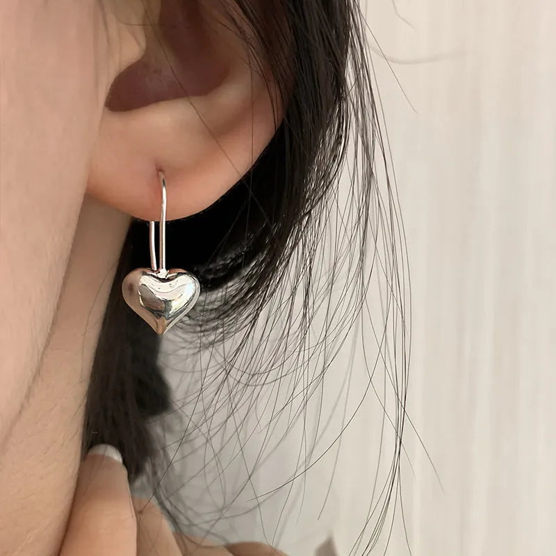Women's silver heart-shaped earrings with glossy three-dimensional Korean-style design