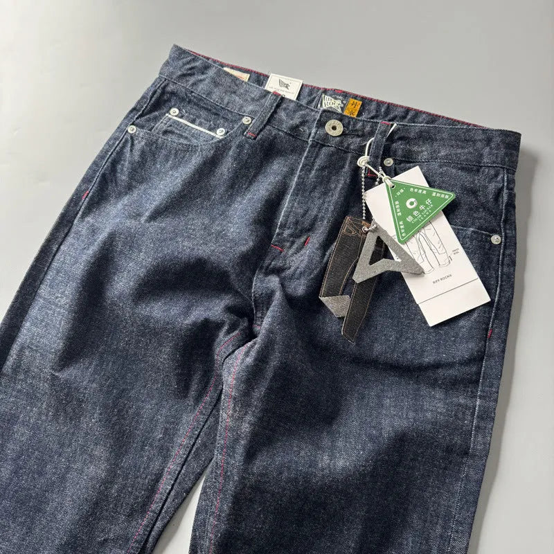 Men's primary colour straight leg jeans with a five-pocket design and mid-rise waist.