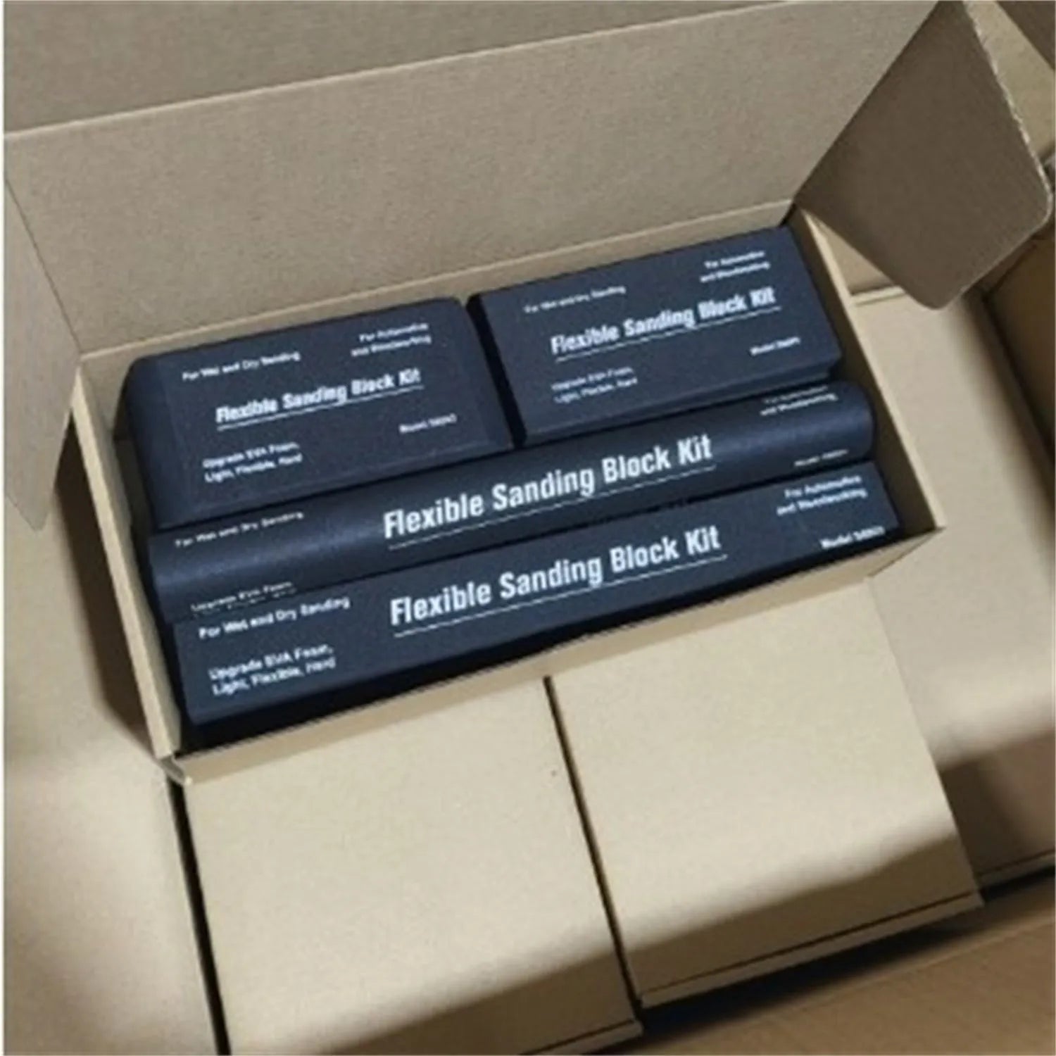 Seven black metal EVA frosted building blocks arranged together showing matte surface texture