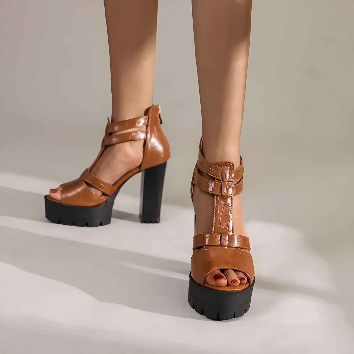 A pair of casual platform high heel sandals with a back zipper, shown in black.