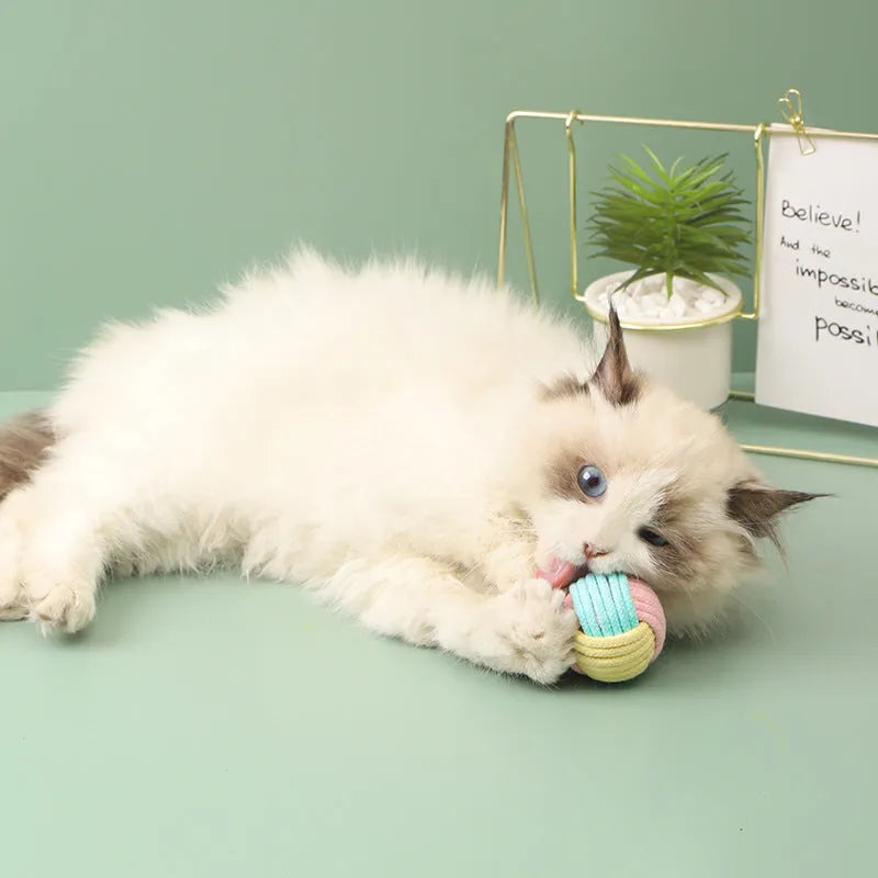 Handmade plush cotton cat hair ball toy in blue powder, green blue, and pink green colours