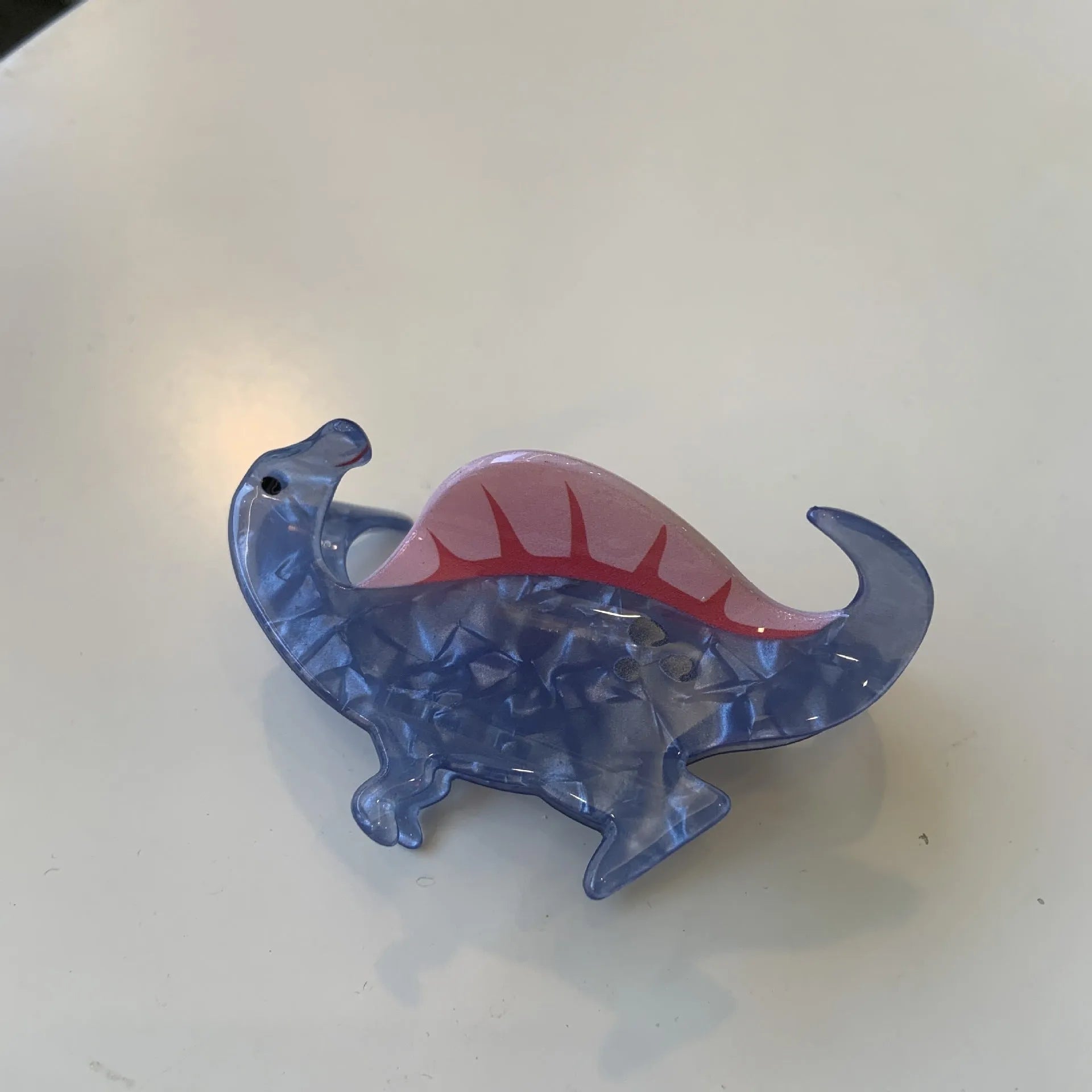 Acrylic dinosaur-themed hair clip with jaw grip design in one of six colour variations