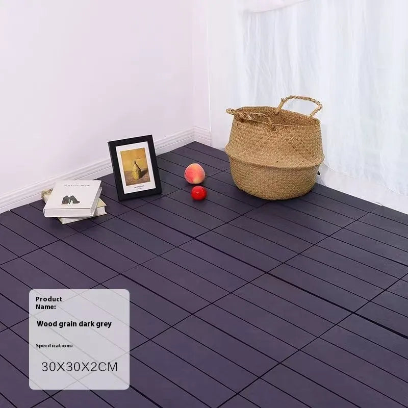 Ten wood grain finish plastic interlocking floor tiles showing their 300x300mm size and non-slip surface.
