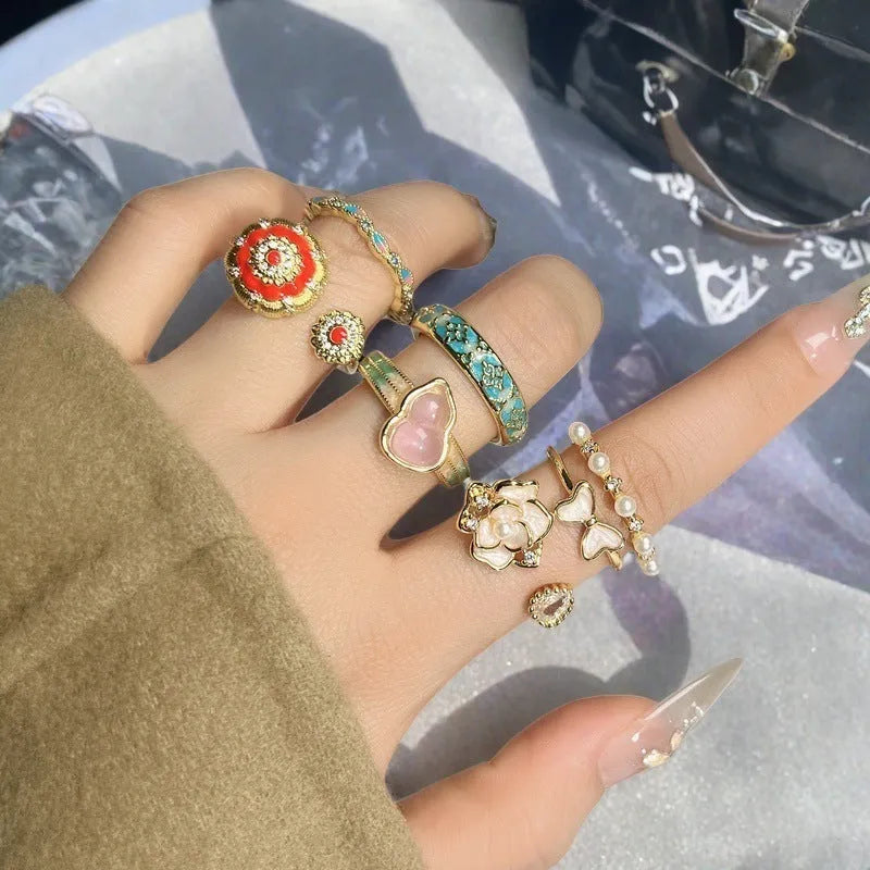 Adjustable vintage oil dripping finish copper ring with gourd motif and inlaid zircon stones.