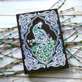 Black A5 diamond painting notebook with peacock design and rhinestone drills