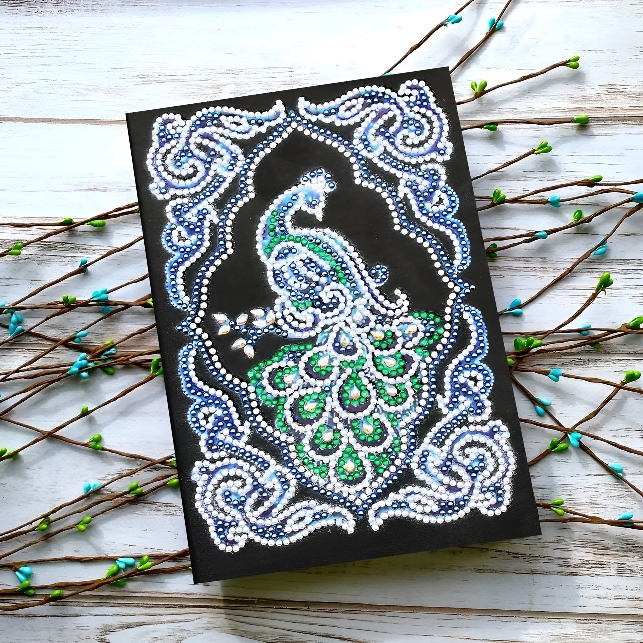 Black A5 diamond painting notebook with peacock design and rhinestone drills